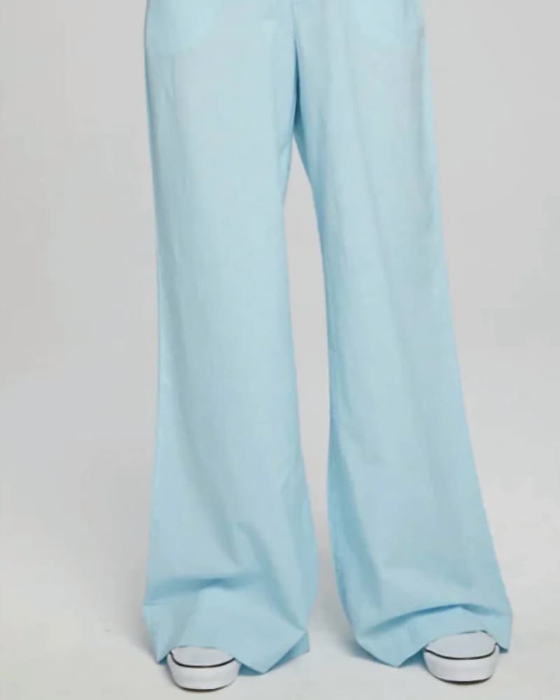 Front of a model wearing a size L Simone Trousers in Clear Sky in Clear Sky by Chaser. | dia_product_style_image_id:339920
